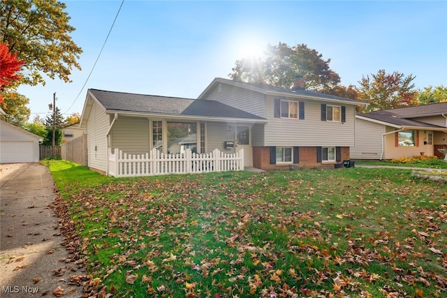 tri-level home with a front yard