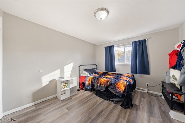 bedroom featuring hardwood / wood-style floors