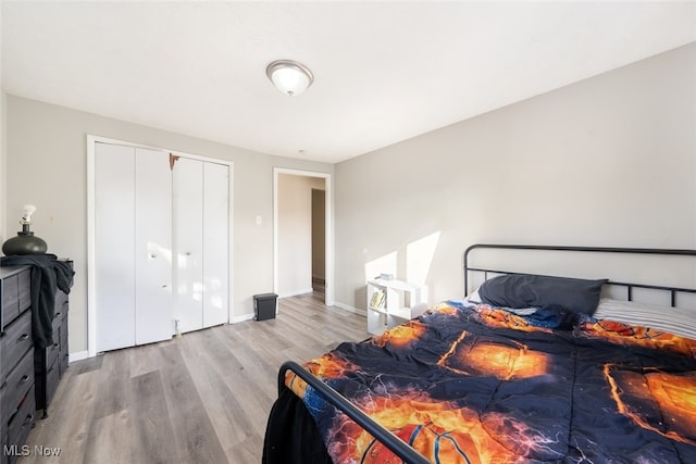 bedroom featuring a closet and light hardwood / wood-style flooring