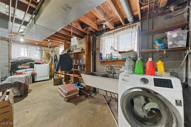 basement with washer / clothes dryer and sink