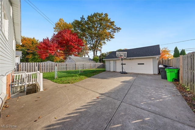 view of patio with an outdoor structure and a garage