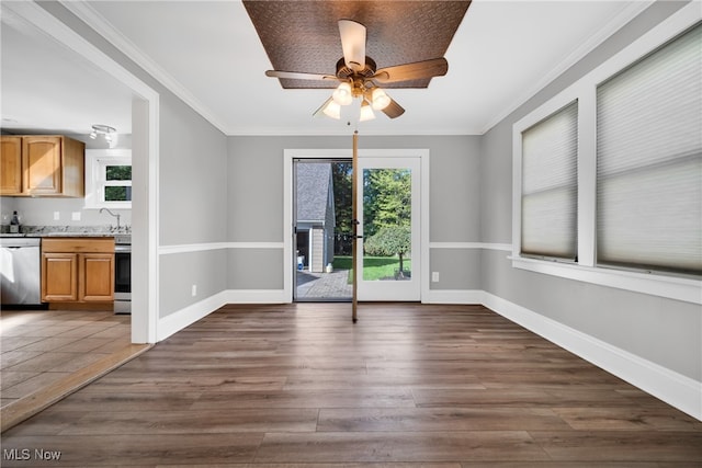 unfurnished dining area with crown molding, dark hardwood / wood-style floors, and ceiling fan