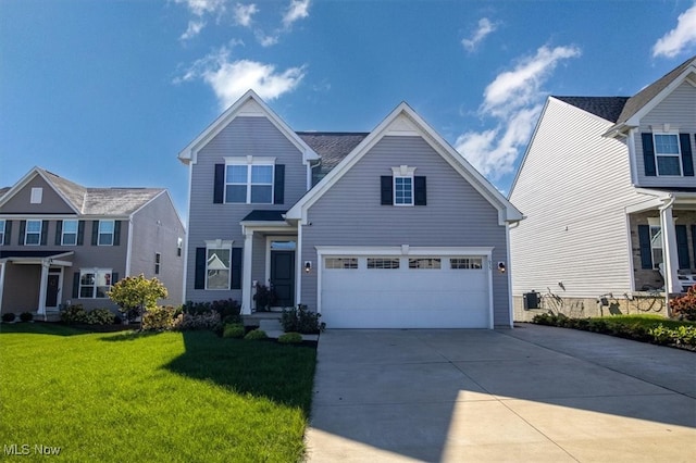 front of property with a front yard and a garage