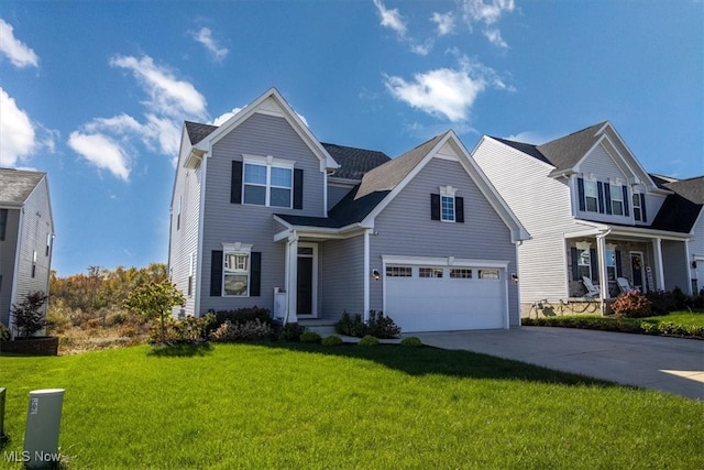 view of front of house featuring a front lawn and a garage