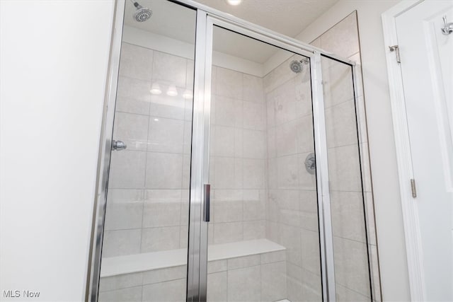 bathroom featuring an enclosed shower