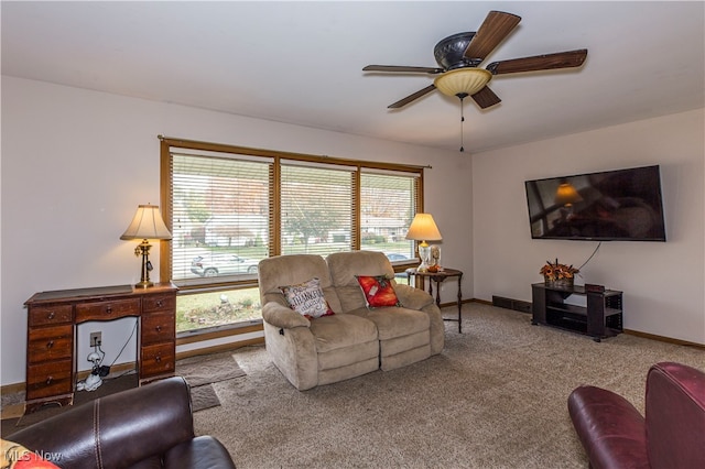 carpeted living room featuring ceiling fan