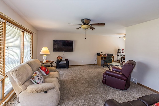 living room featuring ceiling fan and carpet floors