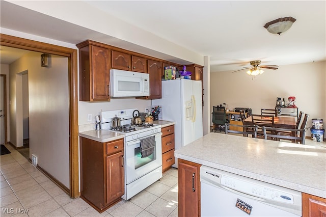 kitchen featuring white appliances, light tile patterned floors, and ceiling fan