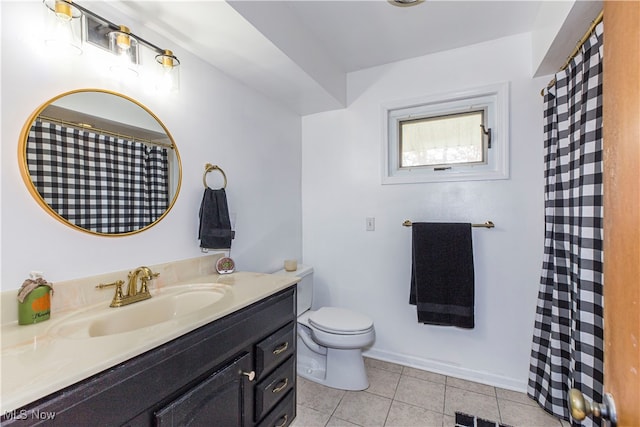 bathroom featuring toilet, vanity, and tile patterned floors