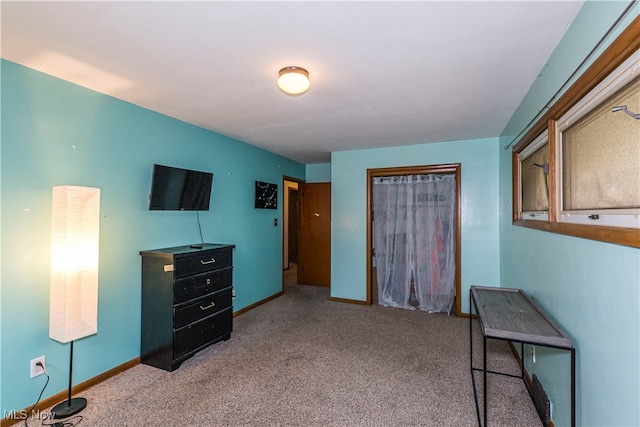 bedroom featuring light colored carpet