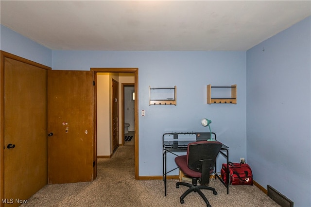 office area featuring light colored carpet