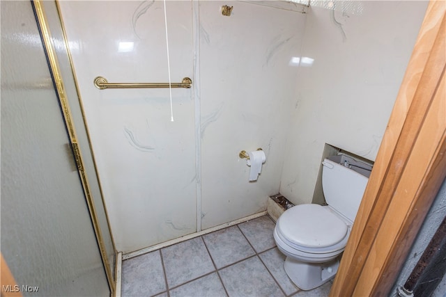 bathroom featuring tile patterned floors and toilet