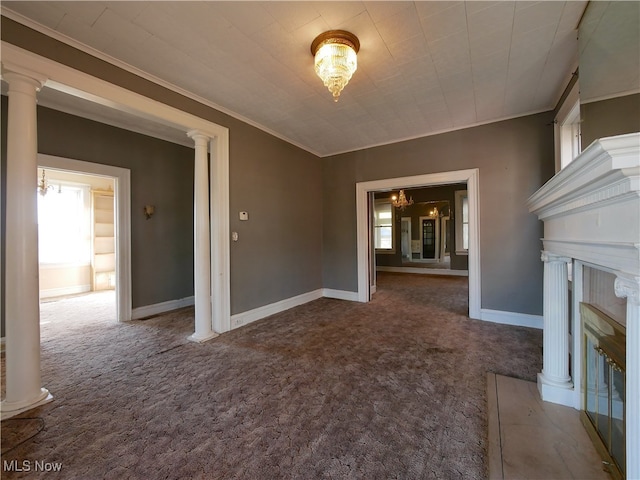 unfurnished living room featuring ornamental molding, carpet, and plenty of natural light