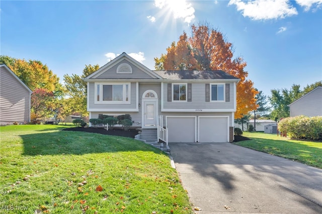 bi-level home featuring a front lawn and a garage