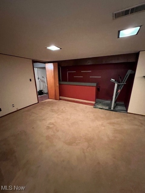 basement with carpet flooring