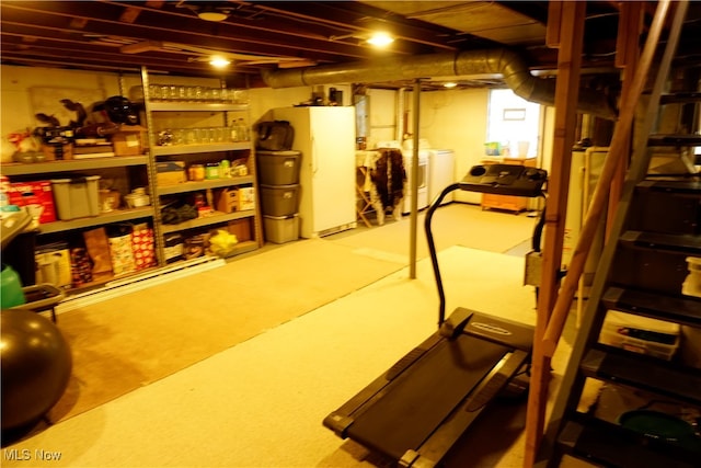 interior space featuring water heater and washing machine and clothes dryer