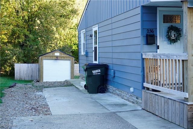 view of property exterior featuring an outdoor structure and a garage