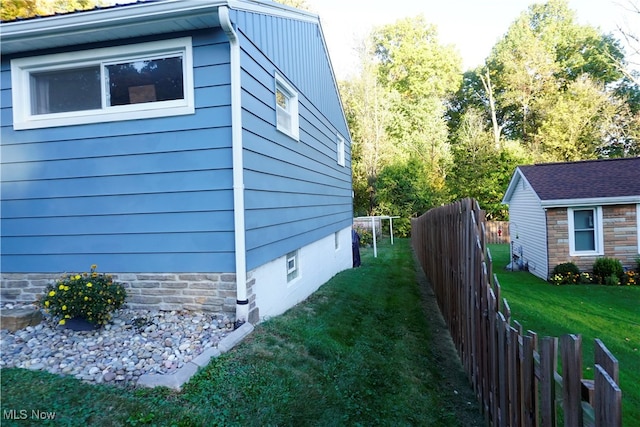 view of home's exterior featuring a yard