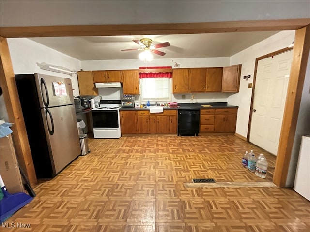 kitchen featuring black dishwasher, white electric range, sink, stainless steel refrigerator, and ceiling fan