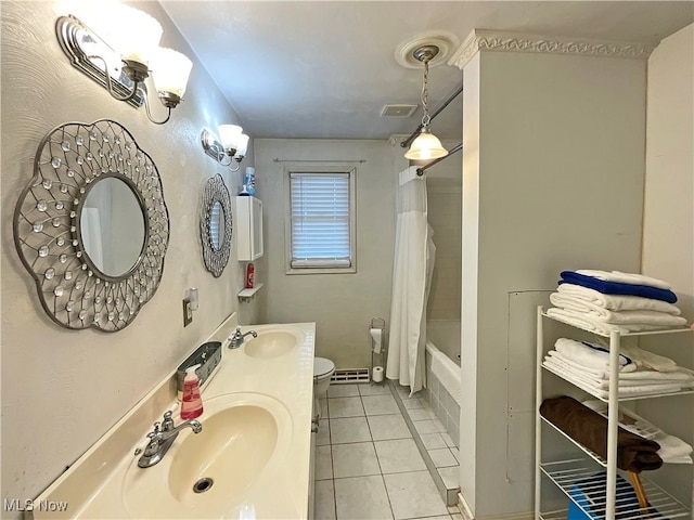 full bathroom with toilet, vanity, shower / bathtub combination with curtain, and tile patterned floors