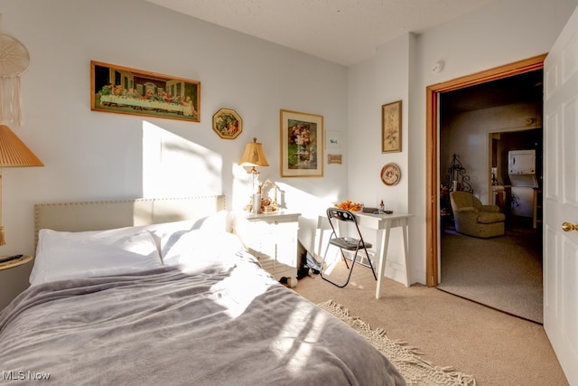 bedroom featuring a closet and light colored carpet