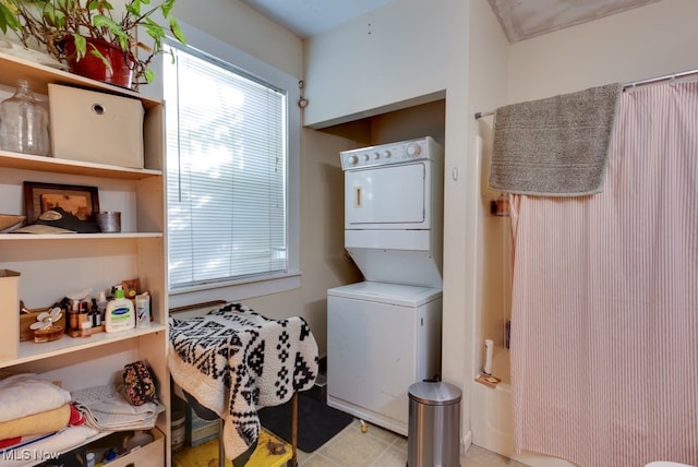 laundry room with stacked washer and dryer