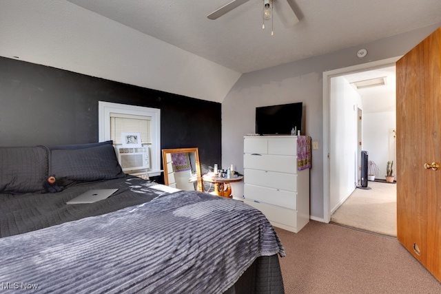 bedroom with ceiling fan, cooling unit, vaulted ceiling, and light colored carpet