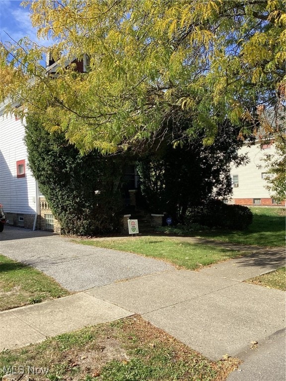 exterior space with a lawn