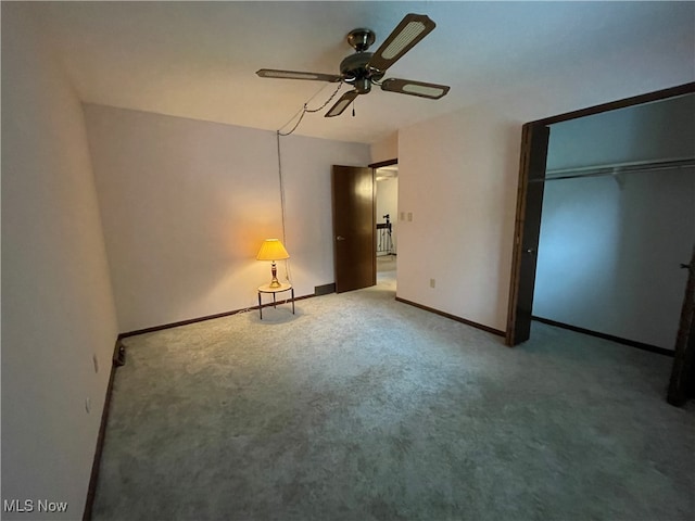 unfurnished bedroom with carpet floors, a closet, and ceiling fan