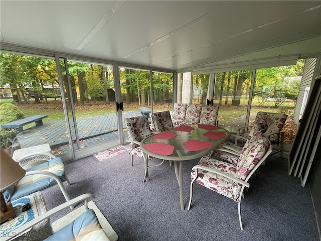 sunroom / solarium with lofted ceiling