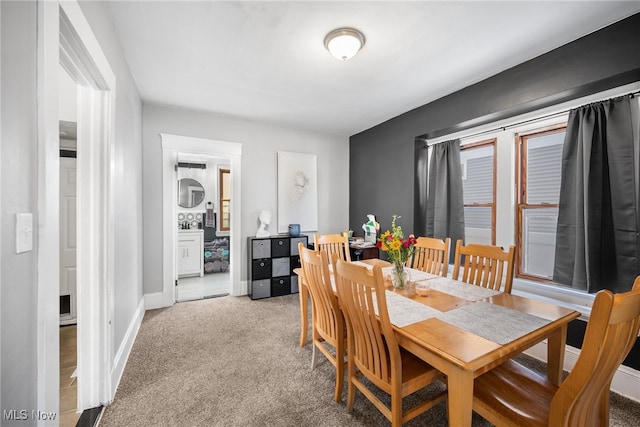 dining room with light carpet