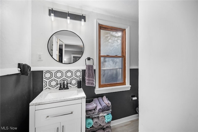 bathroom with vanity, tasteful backsplash, toilet, and wood-type flooring