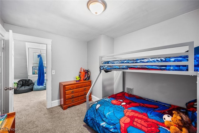 bedroom featuring light colored carpet