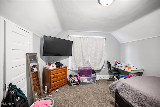 carpeted bedroom with vaulted ceiling