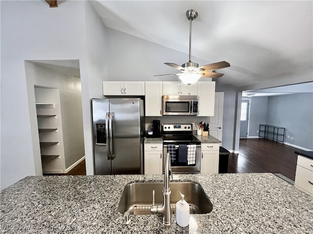 kitchen featuring white cabinetry, light stone countertops, and stainless steel appliances