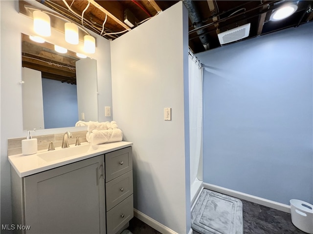 bathroom with vanity and a shower with curtain