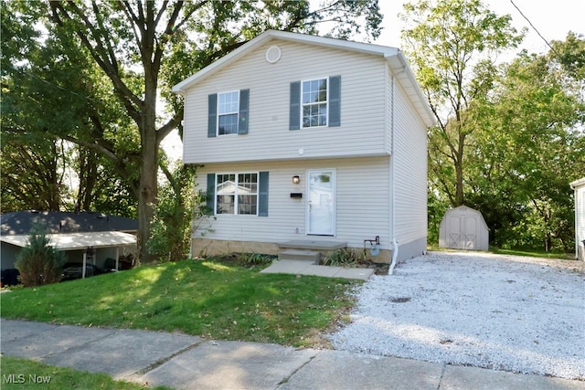 view of front of house featuring a front yard and a shed