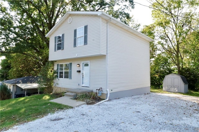 view of front of home featuring a storage unit