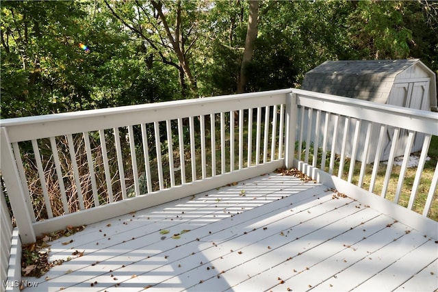 wooden deck featuring a shed