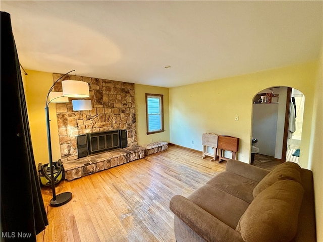 living room with a fireplace and hardwood / wood-style flooring