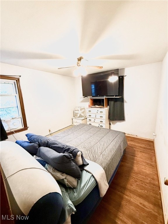 bedroom featuring wood-type flooring and ceiling fan