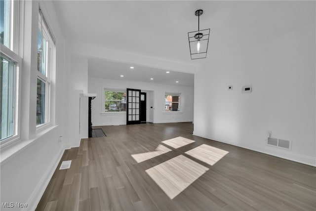 unfurnished living room featuring wood-type flooring