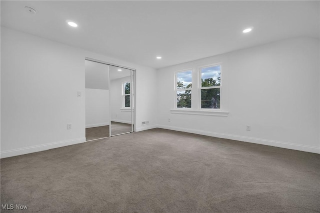 unfurnished room with carpet floors