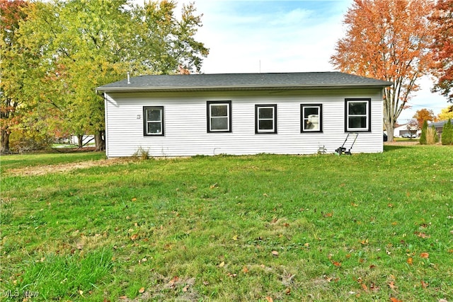 view of property exterior with a yard