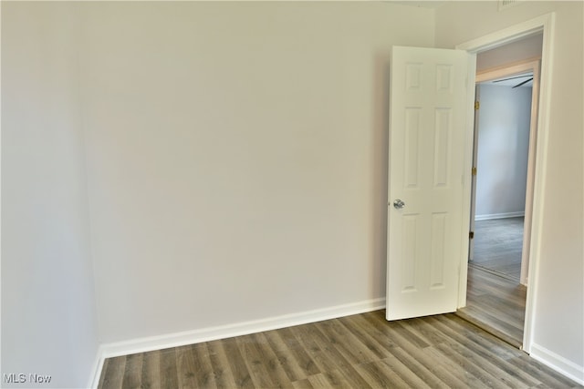 spare room featuring hardwood / wood-style flooring