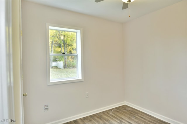 unfurnished room with hardwood / wood-style floors and ceiling fan