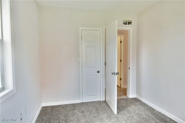 unfurnished bedroom featuring carpet