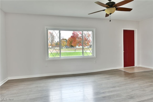 unfurnished room featuring light hardwood / wood-style flooring and ceiling fan