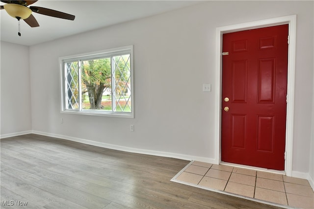 foyer entrance with light hardwood / wood-style flooring and ceiling fan