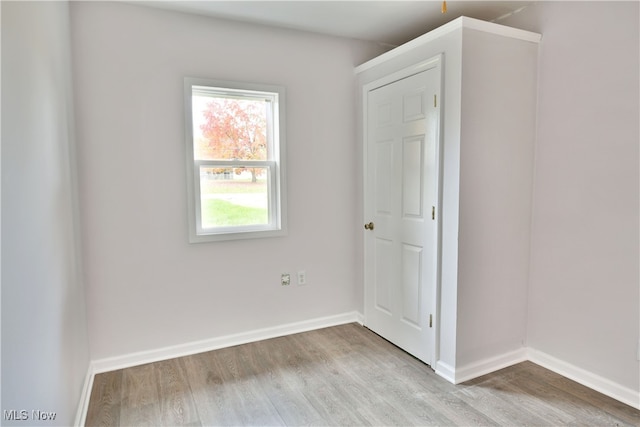 spare room featuring light hardwood / wood-style floors